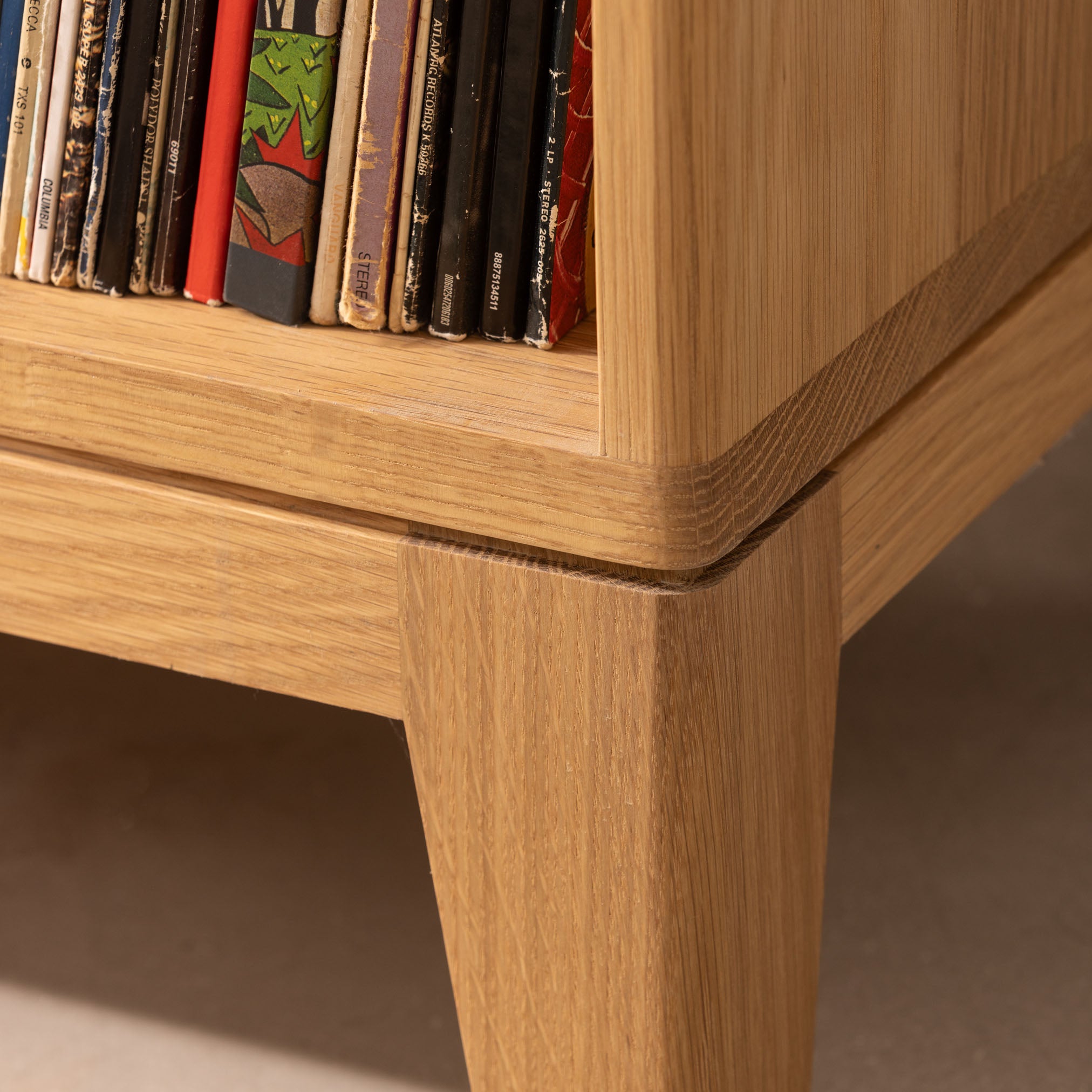 Shadow gap detailing on handmade oak record cabinet